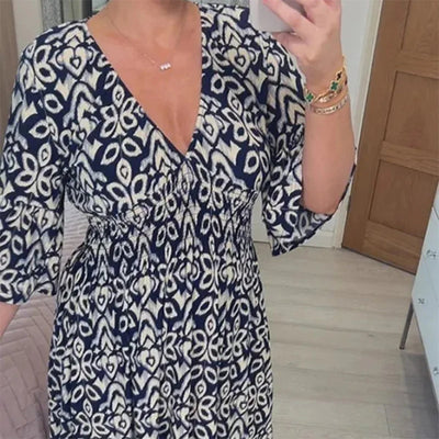 Ciona | Robe fleurie avec décolleté en V